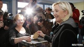 National Front leader Marine Le Pen casts her ballot, 20 Mar 11