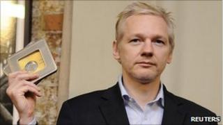Julian Assange with leaked data, Reuters