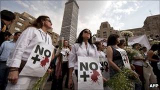Protesters in Mexico City with signs reading "No More Blood" during demonstrations in April