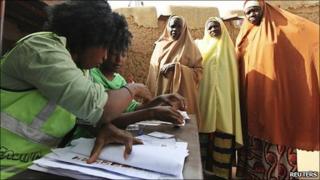 Voters queue to cast their ballots at Daura, in Katsina state, in northern Nigeria 16 April 2011