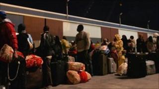 Foreign workers and Libyans queue to try to leave war-torn Misrata