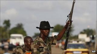 Soldiers from the Invisible Commandos loyal to Ibrahim Coulibaly man a roadblock in the PK-18 area of Abobo neighborhood, in Abidjan, Ivory Coast Monday 18 April 2011