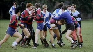 Boys playing rugby
