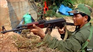 Cambodian soldiers stand guard near by the Cambodia-Thailand border in Oddar Meanchey province on April 25, 2011.
