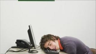 Man napping at desk