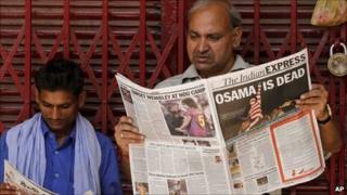 Indian man reads a newspaper