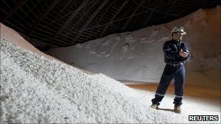 A Potash Corporation worker holding a handful of potash