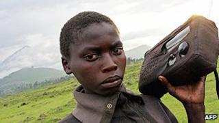 Refugee listens to the radio