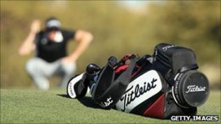 Titleist golf bag with golfer in background