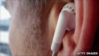 Man listening to music, Getty