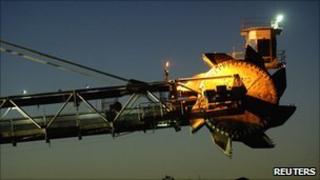 A reclaimer places coal in stockpiles after processing at Rio Tinto's mine
