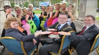The Mayor of Belfast Niall O Donnghaile (centre) with the Culture Minister Caral ni Chuilin and the Social Development Minister Nelson McCausland