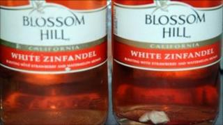 Wine with chewing gum at bottom of bottle