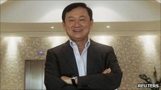 Thailand's former Prime Minister Thaksin Shinawatra poses for a photograph at his residence in Dubai