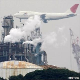 Aeroplane over factory
