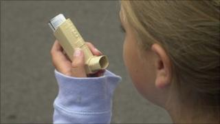 asthma sufferer using inhaler