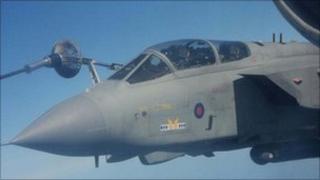 A plane is refuelled in mid-air