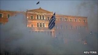 Tear gas clouds surround the Greek parliament