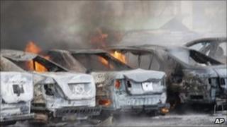 Burning vehicles in police HQ car park