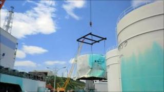 Battered heavy oil tank removed from Fukushima - 29 June