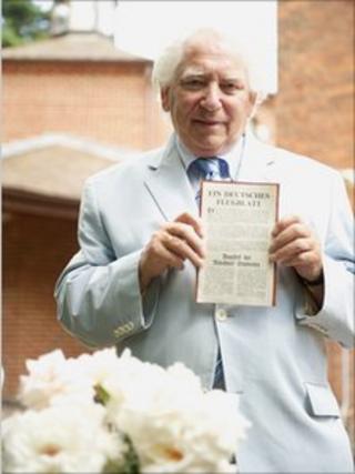 William Kaczynski holds a rare White Rose leaflet in the grounds of the Beth Shalom Holocaust Centre in Laxton, Nottinghamshire