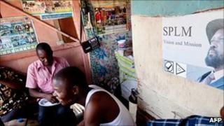 Men listen to Radio Miraya in Juba