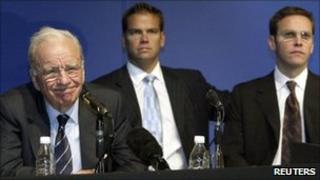 Media baron Rupert Murdoch (L) with his sons Lachlan (C) and James attend a News Corp annual general meeting in Adelaide - 9 October 2002