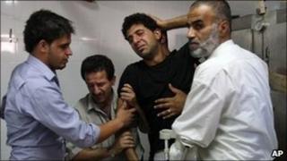 Friends and relatives of Ibrahim Sarhan at the morgue in Rafidiya Hospital, Nablus, 13 July