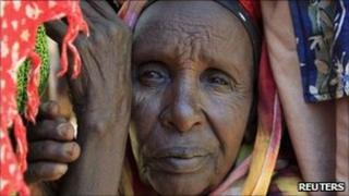 A newly-arrived refugee waits for registration outside at Dadaab camp, near Kenya"s border with Somalia, July 16, 2011