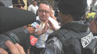 Columnist Emilio Palacio outside the court