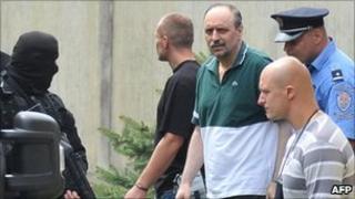 Goran Hadzic surrounded by security