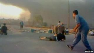 Supplied image said to show protesters in Hama avoiding gunfire. 31 July 2011