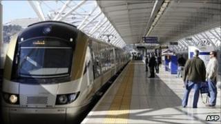 Passengers wait to get on the Gautrain, Africa"s first high-speed rail line, on August 2, 2011 in Pretoria.