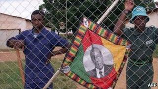Supporters of President Robert Mugabe on a white-owned farm (2000)