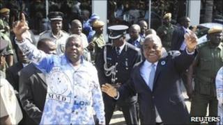 President Rupiah Banda (r) waves to supporters at a rally in Lusaka earlier this month
