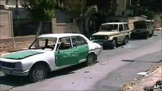 State TV images show damaged cars in Hama. 4 Aug 2011