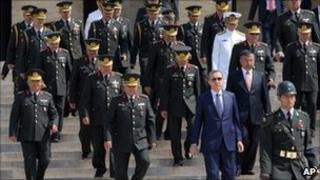 Prime Minister Recep Tayyip Erdogan is accompanied by top army generals after the military's annual meeting in Ankara (1 August 2011)