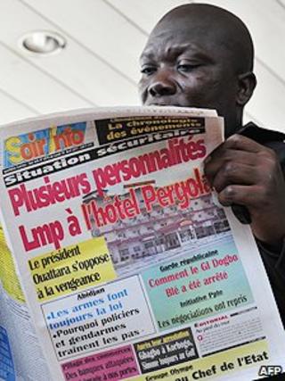 Newspaper reader in Ivory Coast