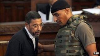 Ali Seriati, Tunisia's former security chief, arrives for a trial hearing at a court in Tunis on 26 July.