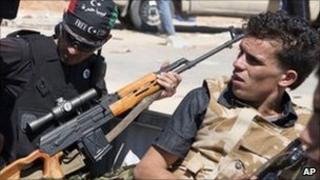 Libyan rebels in the back of a pick-up truck near Zawiya, Libya, 13 August 2011
