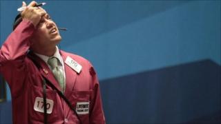 Trader works on the floor of the New York Stock Exchange, August 10, 2011