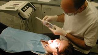 Dentist using the CarieScan device