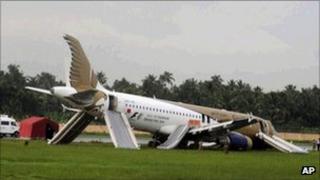 A Gulf Air passenger plane lies on the ground after it skidded off the runway at Kochi International Airport in southern India on 29 August 2011