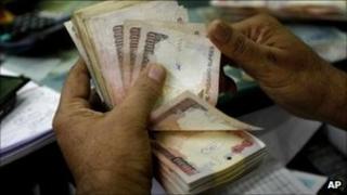 Man counting rupees in Bangalore