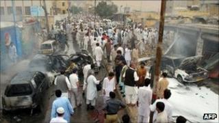 Residents gather at the site of a car bomb blast in Quetta on 31 August 2011