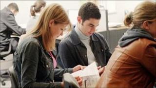 students looking at work