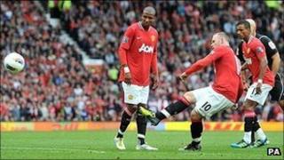 Wayne Rooney scores from a free-kick against Arsenal
