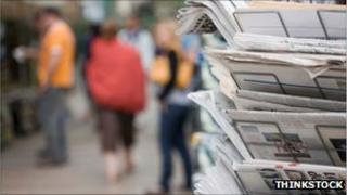 Newspaper rack on street
