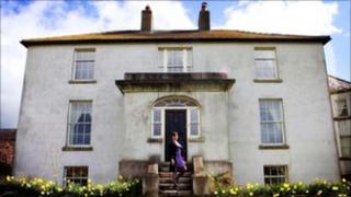 Jillian Godsil outside her house