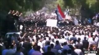 Anti-government protesters take part in a funeral in Idlib for four residents killed on 2 September 2011 in this still image taken from a video posted on 3 September 2011 on a social media website. Reuters is unable to independently verify the contents of the image.